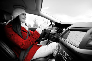 Women inside of the car, using navigational equipment